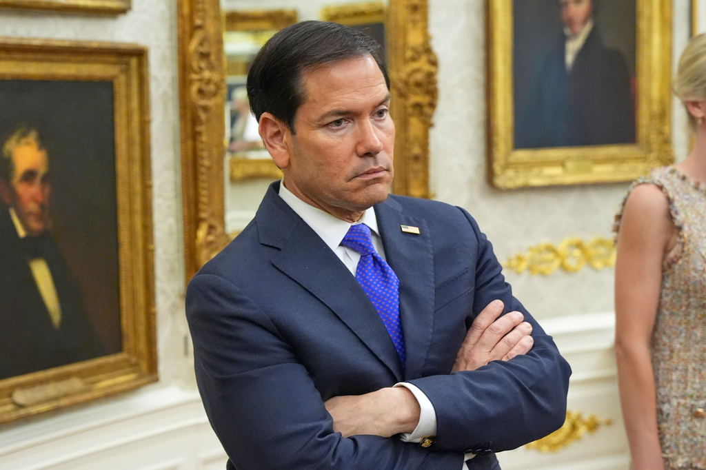 Secretary of State Marco Rubio listens as President Donald Trump speaks during an event about healthcare in the Oval Office of the White House, Friday Sept. 18, 2026, in Washington. (AP Photo/Jacquelyn Martin)