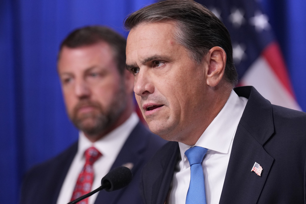 Attorney General Todd Blanche speaks during a news conference at the Department of Justice, Wednesday Sept. 30, 2026, in Washington, as Secretary of Homeland Security Markwayne Mullin, looks on. (AP Photo/Jacquelyn Martin)