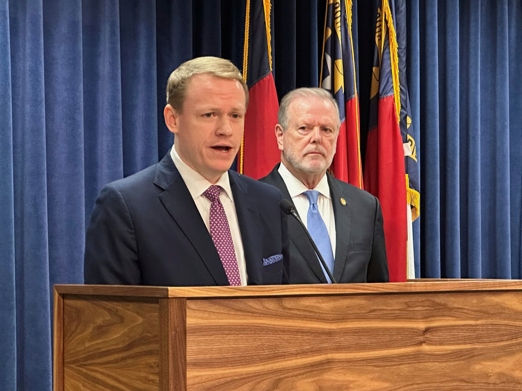 North Carolina state House Speaker Destin Hall, R-Caldwell, left, speaks while state Senate leader Phil Berger, R-Rockingham, listens during a Legislative Building news conference in Raleigh, N.C., on Thursday, Sept. 11, 2025 (AP Photo/Gary D. Robertson)