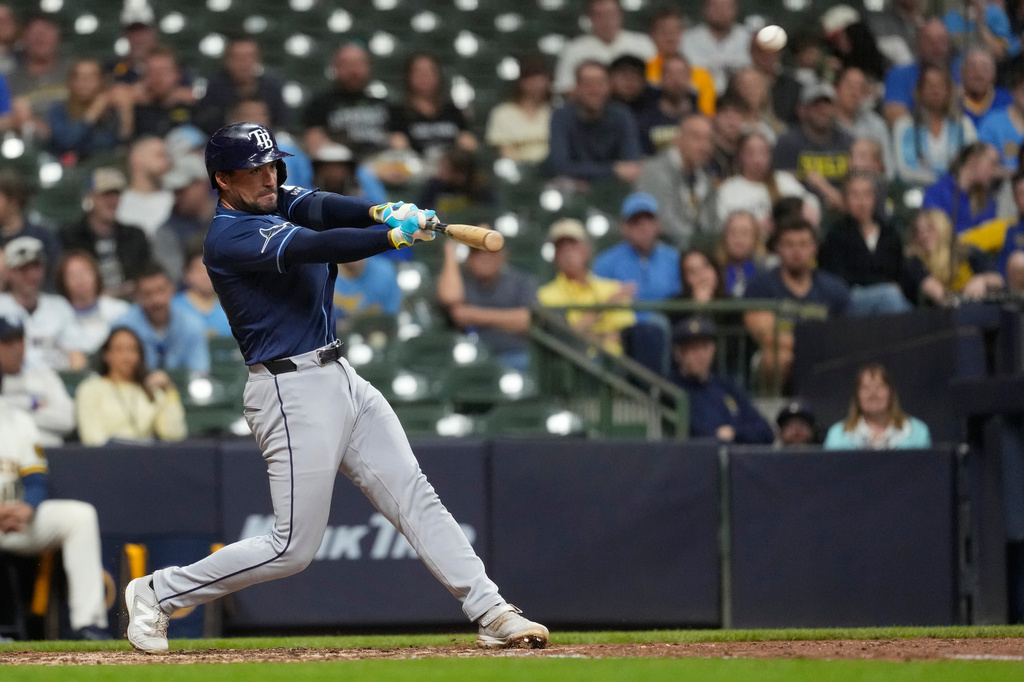 Tampa Bay Rays' Nick Fortes hits an RBI double during the ninth inning of a baseball game against the Milwaukee Brewers, Monday, March 30, 2026, in Milwaukee. (AP Photo/Aaron Gash)