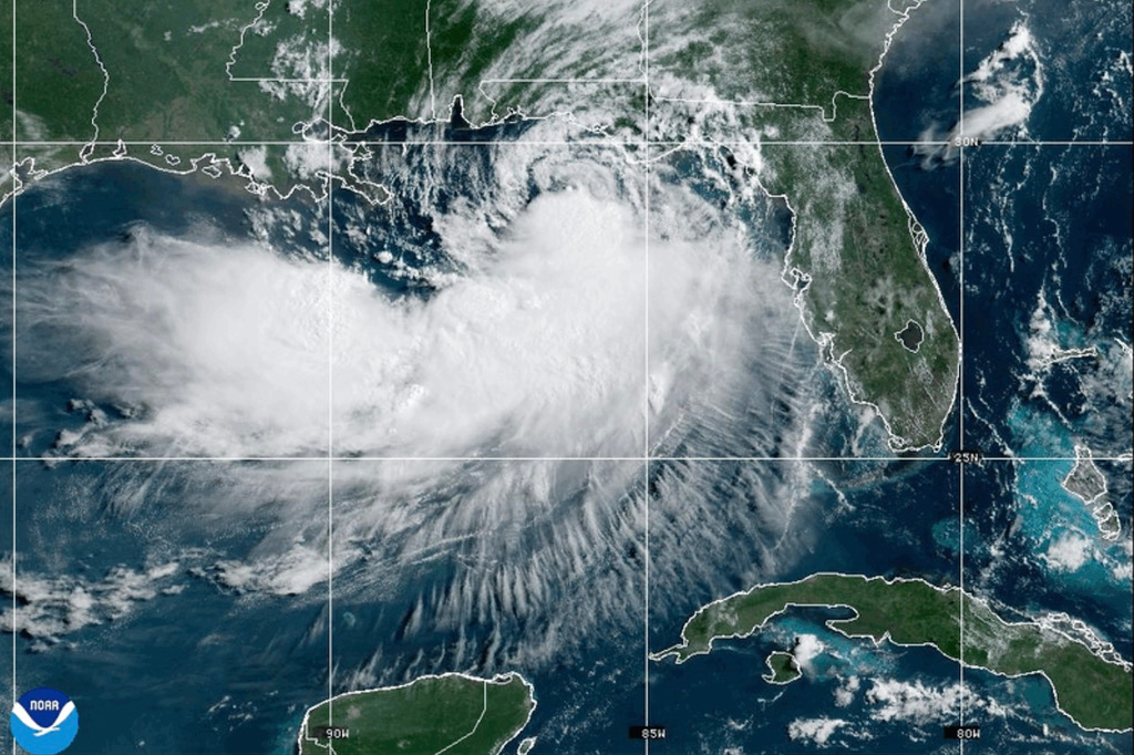 This NOAA satellite image taken at 10:30 a.m. EST on Tuesday, July 21, 2026, shows Tropical Storm Bertha moving along the Gulf of Mexico's northern coast. (NOAA via AP)