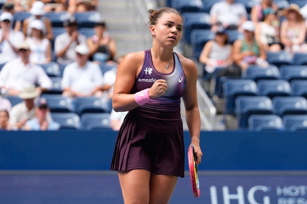 Jasmine Paolini, of Italy, reacts during the first round of the U.S. Open tennis championships against Veronika Erjavec, of Slovenia, Sunday, Aug. 30, 2026, in New York. (AP Photo/Yuki Iwamura)