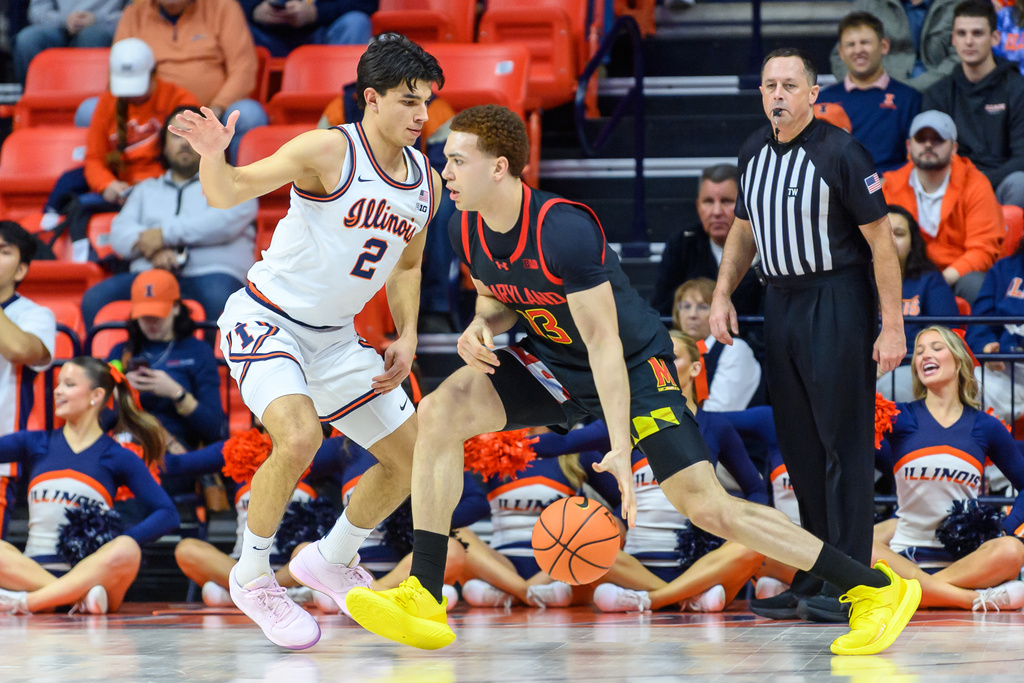 Maryland's Elijah Saunders drives against Illinois' Andrej Stojakovic during the first half of an NCAA college basketball game Wednesday, Jan. 21, 2026, in Champaign, Ill. (AP Photo/Craig Pessman)