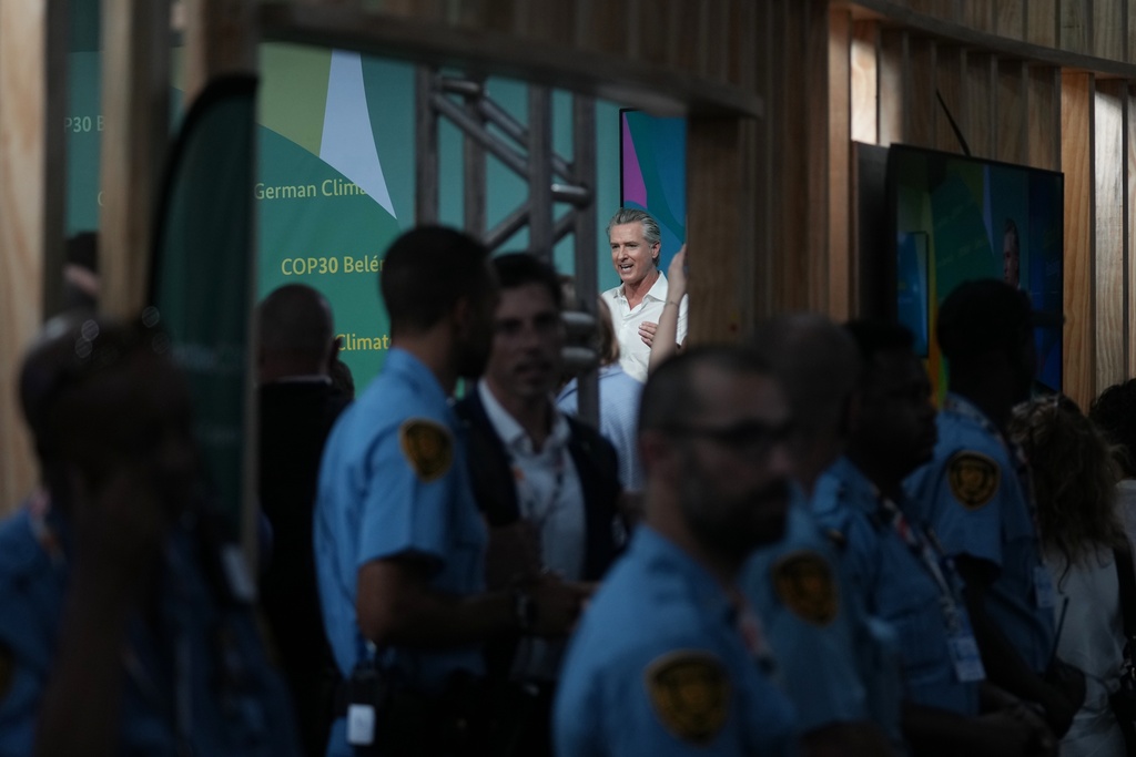 California Gov. Gavin Newsom speaks in the German Pavilion at the COP30 U.N. Climate Summit, Tuesday, Nov. 11, 2025, in Belem, Brazil. (AP Photo/Fernando Llano)