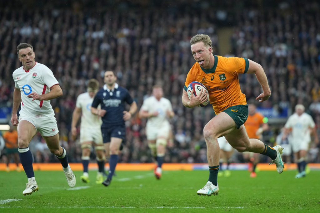 Australia's Harry Potter races in to score a try during the rugby union Nations Series match between England and Australia in Twickenham, London, Saturday, Nov. 1, 2025. (AP Photo/Alastair Grant)