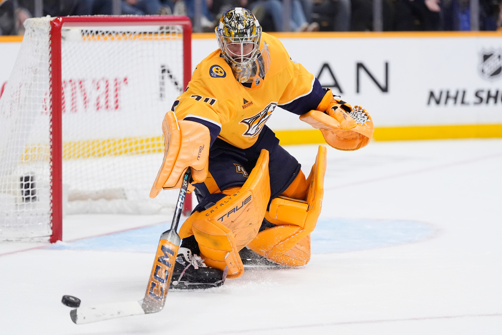 Nashville Predators goaltender Juuse Saros (74) defends the goal during the third period of an NHL hockey game against the San Jose Sharks, Tuesday, March 24, 2026, in Nashville, Tenn. (AP Photo/George Walker IV)