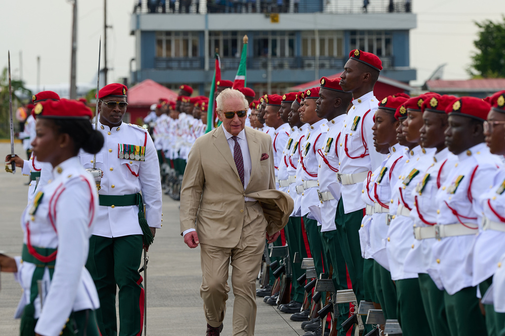 Britain's King Charles III inspects the guard of honor on his arrival at Cheddi Jagan International Airport in Georgetown, Guyana, Thursday, Oct. 29, 2026. (AP Photo/Delano Williams)