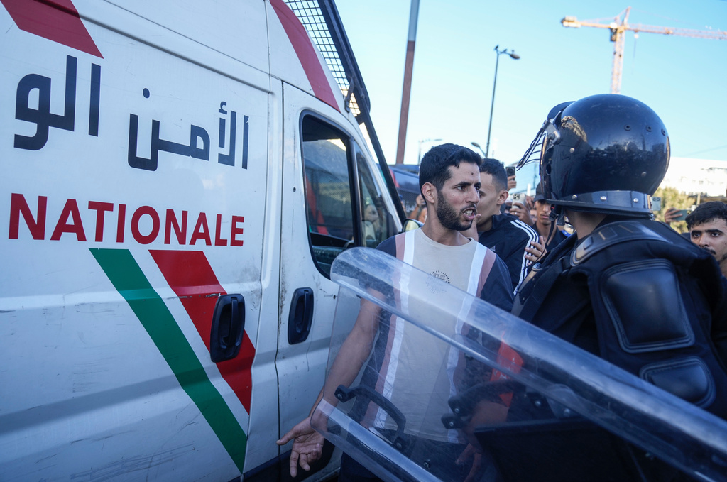 A man is detained while taking part in a youth led protest calling for education and health reforms, in Casablanca, Morocco, Monday, Sept. 29, 2025. (AP Photo/Mosa'ab Elshamy)