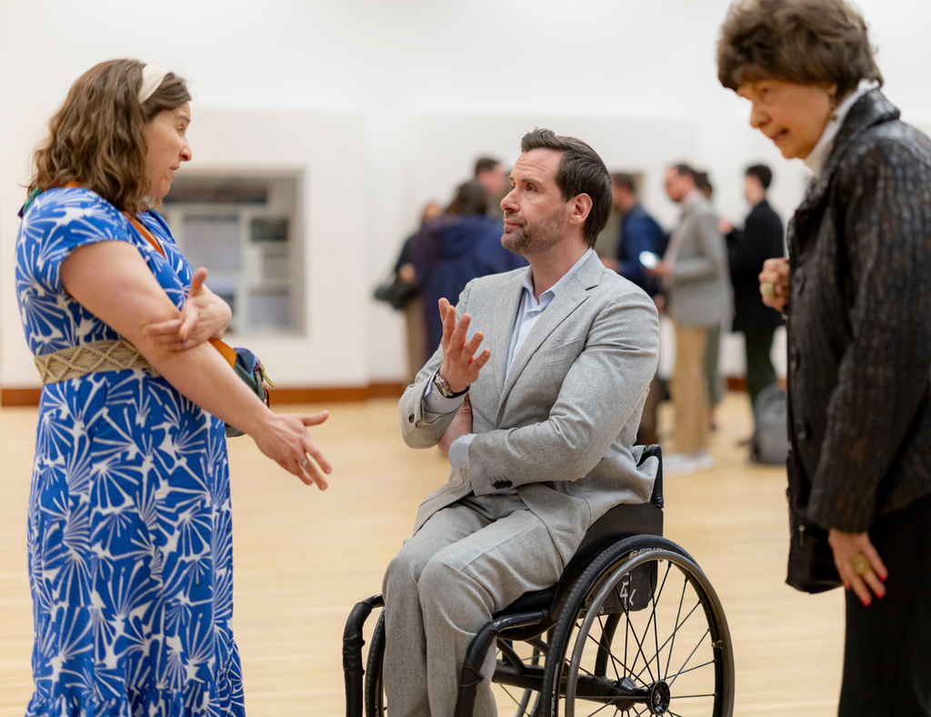 Iowa state Rep. Josh Turek talks with community members following a candidates forum at the State of Iowa Historical Building in Des Moines, Iowa, Wednesday, April 8, 2026. (Nick Rohlman/The Gazette via AP)