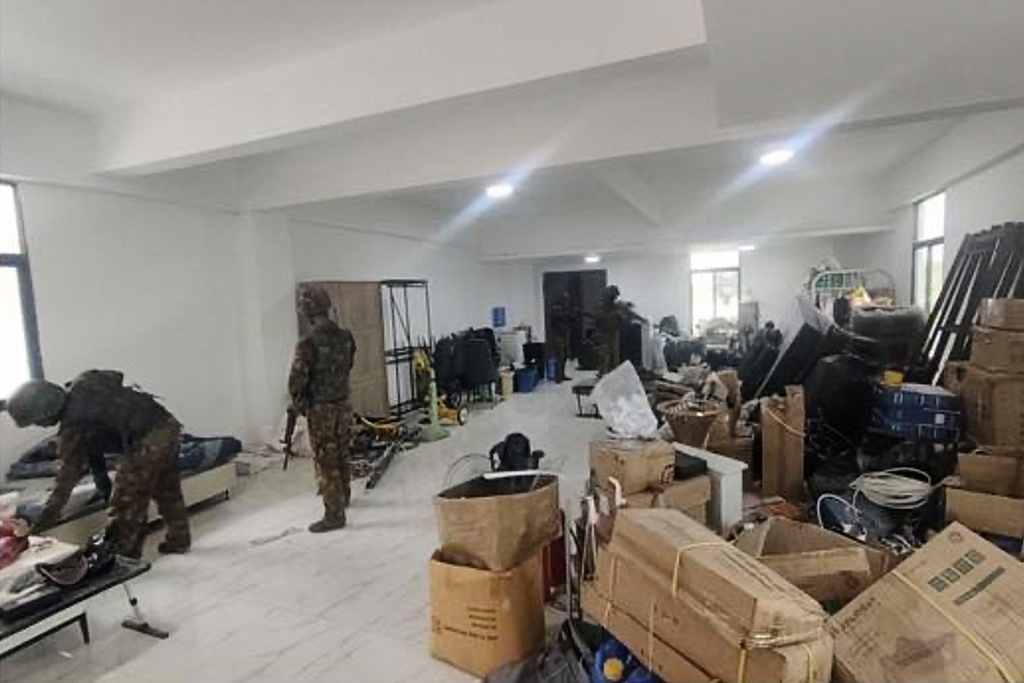 FILE - In this image provided by the Myanmar military on Oct. 19, 2025, soldiers raid the KK Park online scam center in Myawaddy township, Karen State, Myanmar. (The Myanmar Military True News Information Team via AP, File)