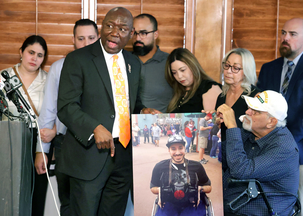 Attorney Benjamin Crump answers questions with family members of Kevin Zavala —including Zavala's mother Ana Zavala and father Carlos Rodriguez Ortiz, right—during a press conference in downtown Orlando, Fla., Wednesday, Sept. 24, 2025. (Joe Burbank/Orlando Sentinel via AP)