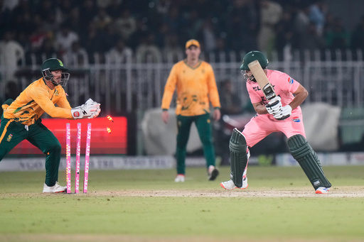 South Africa's Quinton de Kock, left, removes bails to dismiss Pakistan's Usman Khan, right, during the first T20 cricket match between Pakistan and South Africa, in Rawalpindi, Pakistan, Tuesday, Oct. 28, 2025. (AP Photo/Anjum Naveed) South Africa's Quinton de Kock, left, removes bails to dismiss Pakistan's Usman Khan, right, during the first T20 cricket match between Pakistan and South Africa, in Rawalpindi, Pakistan, Tuesday, Oct. 28, 2025. (AP Photo/Anjum Naveed)