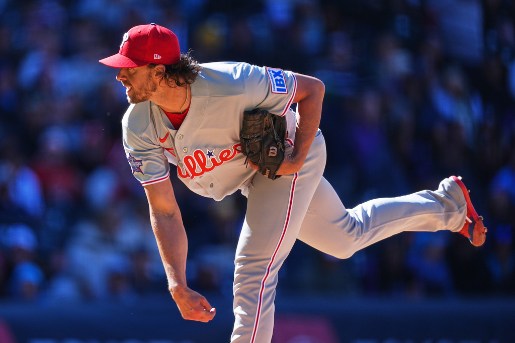 Philadelphia Phillies starting pitcher Aaron Nola works against the Colorado Rockies in the fifth inning of a baseball game Friday, April 3, 2026, in Denver. (AP Photo/David Zalubowski)
