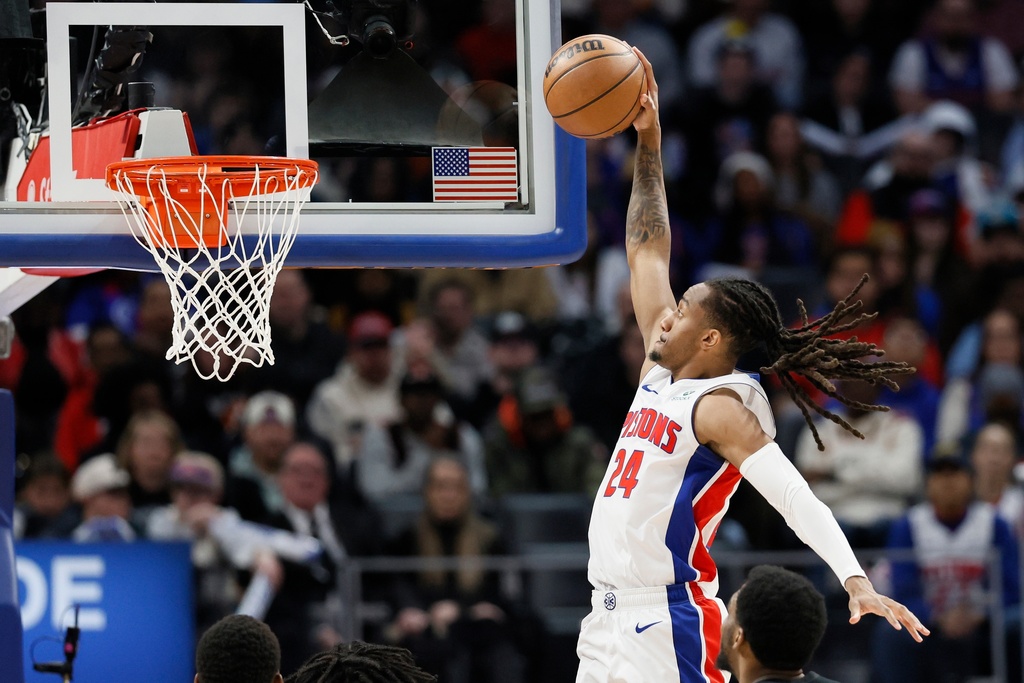 Detroit Pistons guard Daniss Jenkins (24) goes up to dunk the ball against the Brooklyn Nets during the first half of an NBA basketball game, Sunday, Feb. 1, 2026, in Detroit. (AP Photo/Duane Burleson)