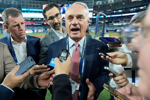MLB commissioner Rob Manfred speaks prior to Game 2 of baseball's World Series between the Toronto Blue Jays and the Los Angeles Dodgers, Saturday, Oct. 25, 2025, in Toronto. (AP Photo/David J. Phillip) MLB commissioner Rob Manfred speaks prior to Game 2 of baseball's World Series between the Toronto Blue Jays and the Los Angeles Dodgers, Saturday, Oct. 25, 2025, in Toronto. (AP Photo/David J. Phillip)