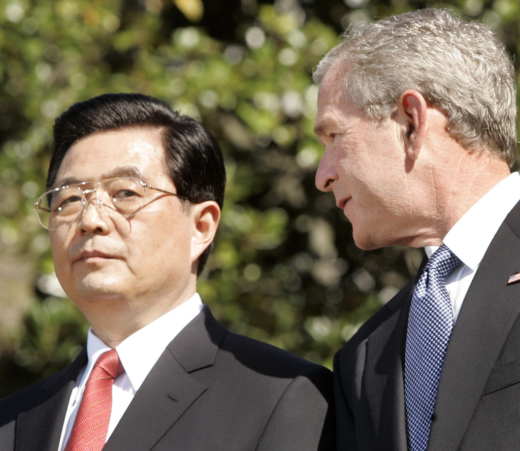 FILE - President Bush, right, and Chinese President Hu Jintao participate in an arrival ceremony on the South Lawn of the White House in Washington, April 20, 2006. (AP Photo/Gerald Herbert, File)