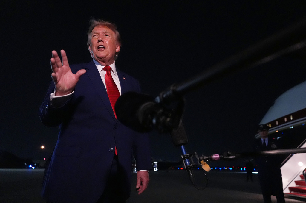 President Donald Trump talks to reporters after arriving on Air Force One Tuesday, Aug. 11, 2026, at Joint Base Andrews, Md. (AP Photo/Mark Schiefelbein)