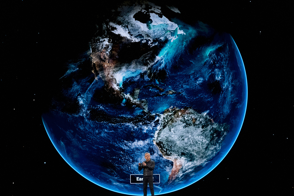 NVIDIA CEO Jensen Huang speaks on how AI infrastructure and AI factories that generate intelligence at scale are powering a new industrial revolution, at Washington Convention Center, Tuesday, Oct. 28, 2025, in Washington. (AP Photo/Manuel Balce Ceneta)