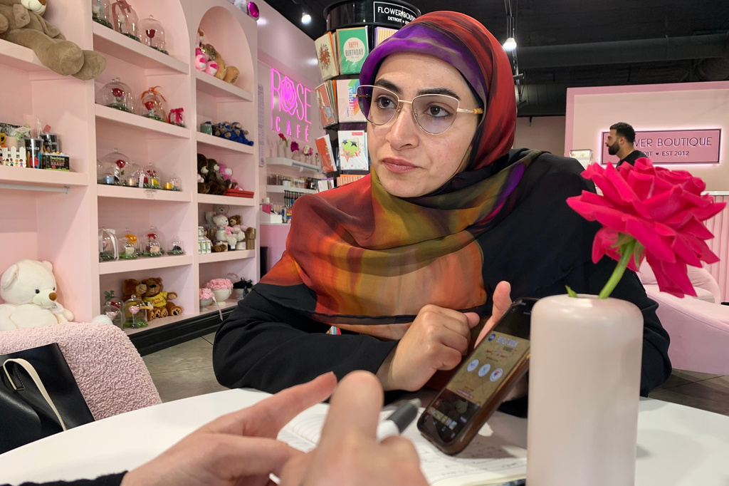 Marwa Mussa discusses plans for a fundraiser while seated at a coffee shop on May 29, 2026, in Dearborn, Mich. (AP Photo/Mike Householder)