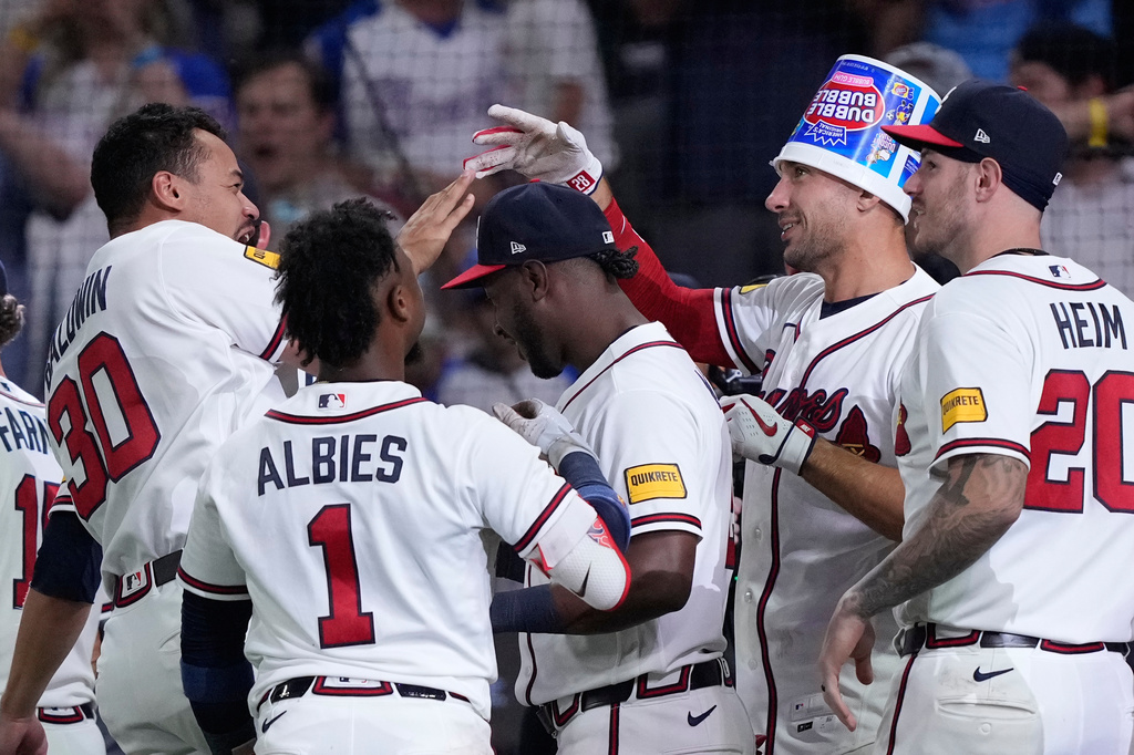 Atlanta Braves' Matt Olson (28) celebrates hitting a walk-off two run home run in the ninth inning of a baseball game against the Detroit Tigers Wednesday, April 29, 2026, in Atlanta. (AP Photo/Brynn Anderson)