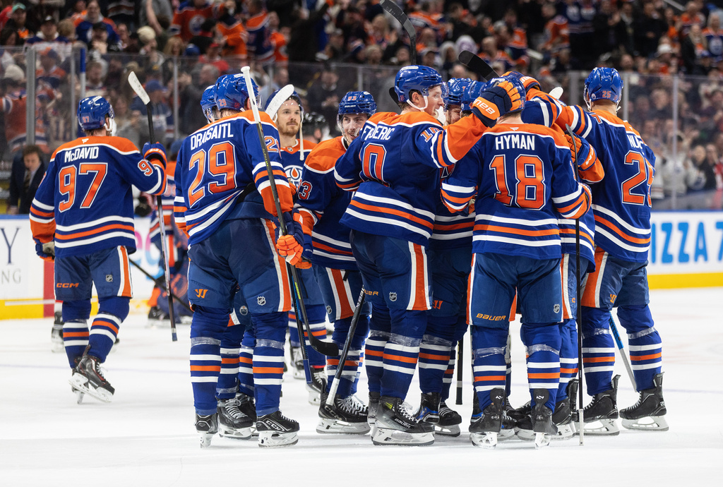 Edmonton Oilers players celebrate the win over the Ottawa Senators in overtime NHL action, in Edmonton on Tuesday, March 3, 2026. (Jason Franson/The Canadian Press via AP)
