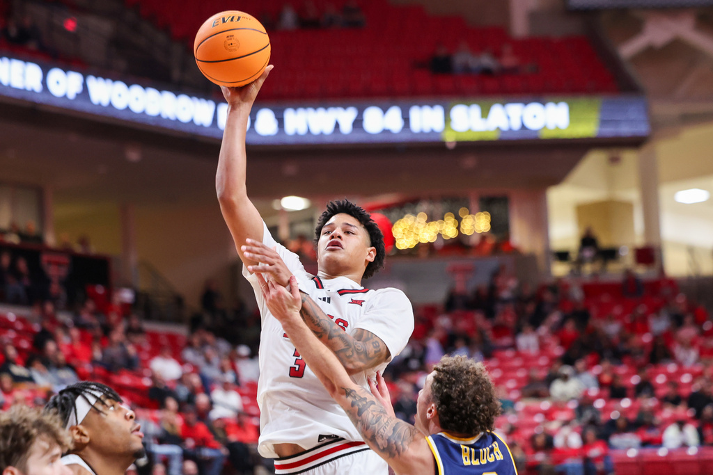 Texas Tech forward Lejuan Watts (3) shoots the ball over Northern Colorado guard Zach Bloch (8) during the second half of an NCAA college basketball game, Tuesday, Dec. 16, 2025, in Lubbock, Texas. (AP Photo/Chase Seabolt)