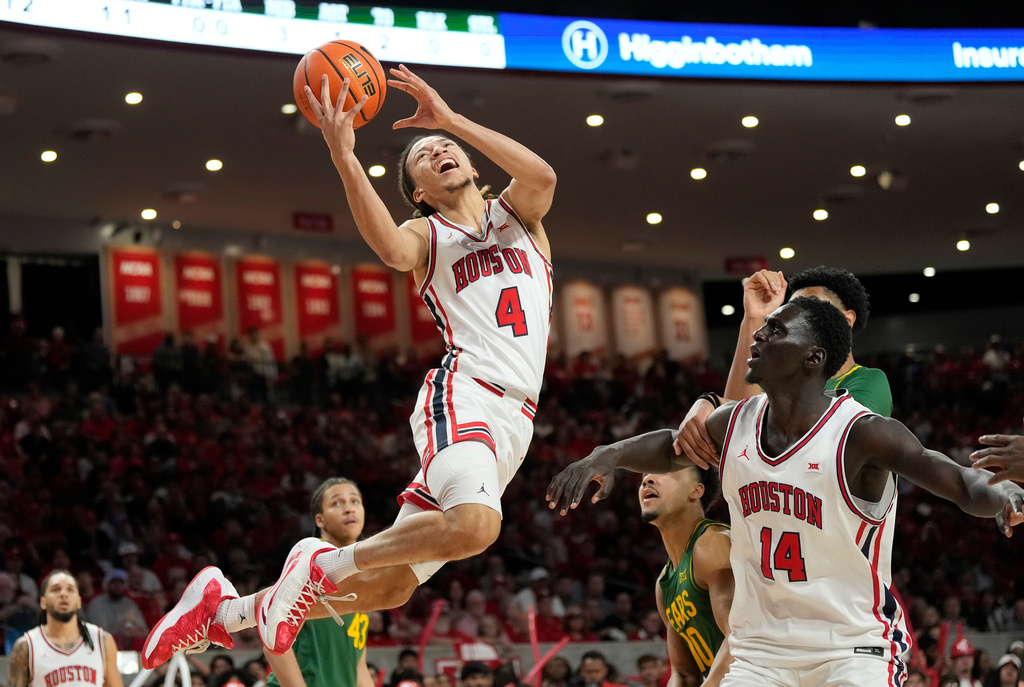 Houston guard Kingston Flemings (4) goes up for a shot at the basket during the first half of an NCAA college basketball game against Baylor, Wednesday March 4, 2026, in Houston. (AP Photo/Karen Warren)