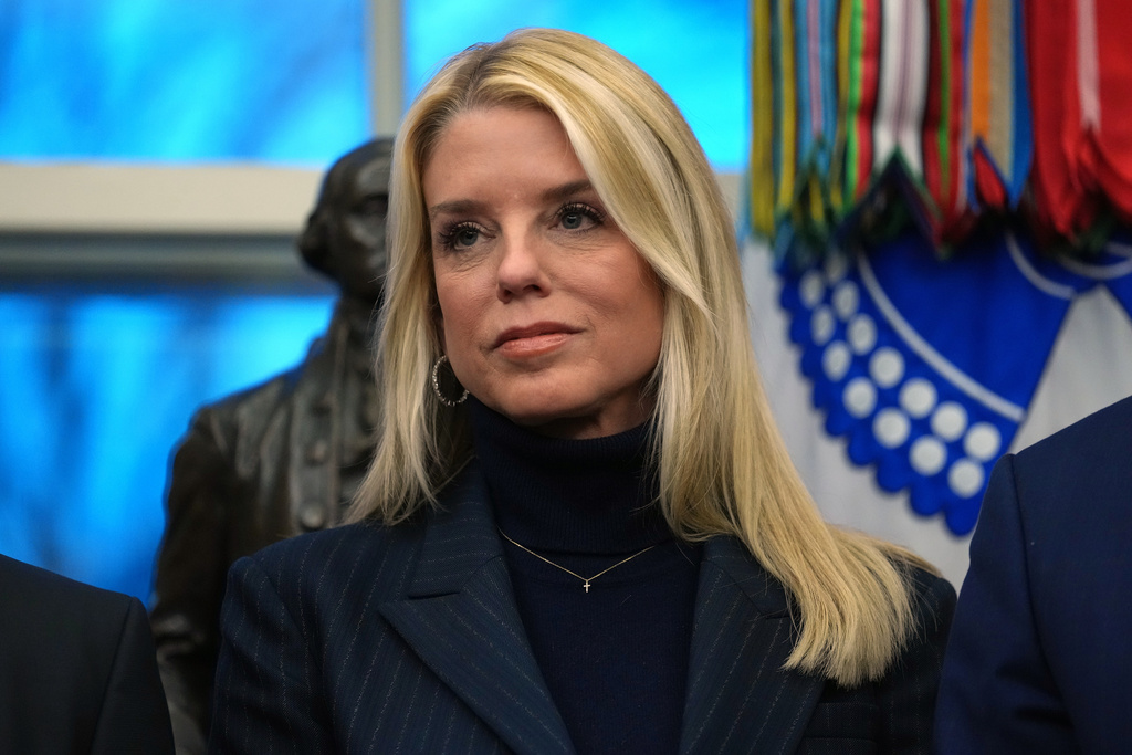 Attorney General Pam Bondi listens as President Donald Trump speaks at an event on addiction recovery in the Oval Office of the White House, Thursday, Jan. 29, 2026, in Washington. (AP Photo/Allison Robbert)