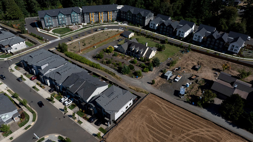 FILE - New construction homes and apartments are seen surrounding an older home on Friday, July 11, 2025, in Happy Valley, Ore. (AP Photo/Jenny Kane, File) FILE - New construction homes and apartments are seen surrounding an older home on Friday, July 11, 2025, in Happy Valley, Ore. (AP Photo/Jenny Kane, File)