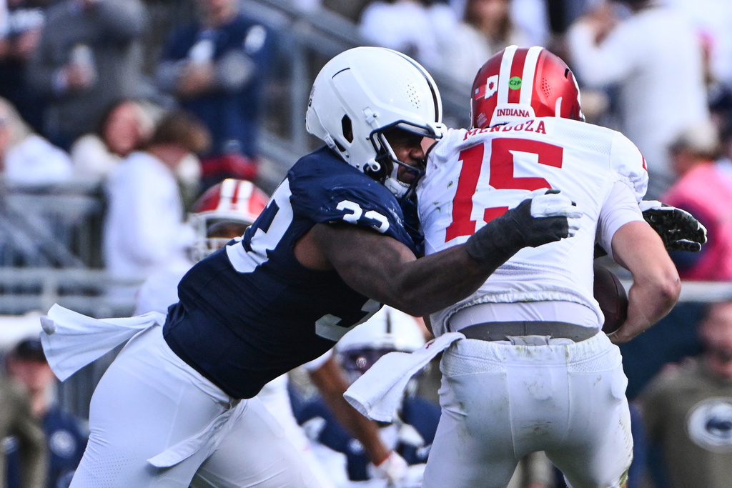 Penn State defensive end Dani Dennis-Sutton (33) sacks Indiana quarterback Fernando Mendoza (15) during the 1st half of an NCAA college football game, Saturday, Nov. 8, 2025, in State College, Pa. (AP Photo/Barry Reeger)