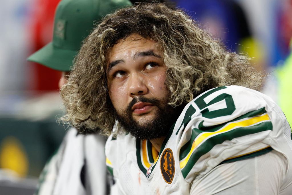 FILE - Green Bay Packers guard Sean Rhyan (75) on the sideline against the Detroit Lions during an NFL football game in Detroit, Nov. 27, 2025. (AP Photo/Rick Osentoski, File)