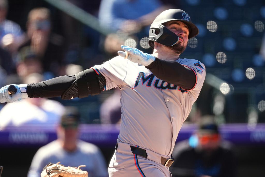 Miami Marlins' Liam Hicks flies out against Colorado Rockies starting pitcher Tanner Gordon in the fifth inning of a baseball game Thursday, Sept. 18, 2025, in Denver. (AP Photo/David Zalubowski)