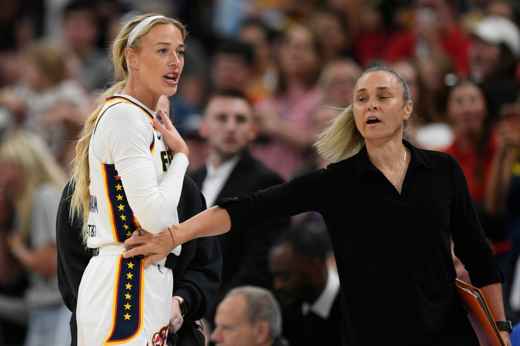 Indiana Fever's Sophie Cunningham reacts while talking to the Chicago Sky bench after being fouled during the first half of an WNBA basketball game in Chicago, Saturday, Aug. 8, 2026. (AP Photo/Paul Beaty)