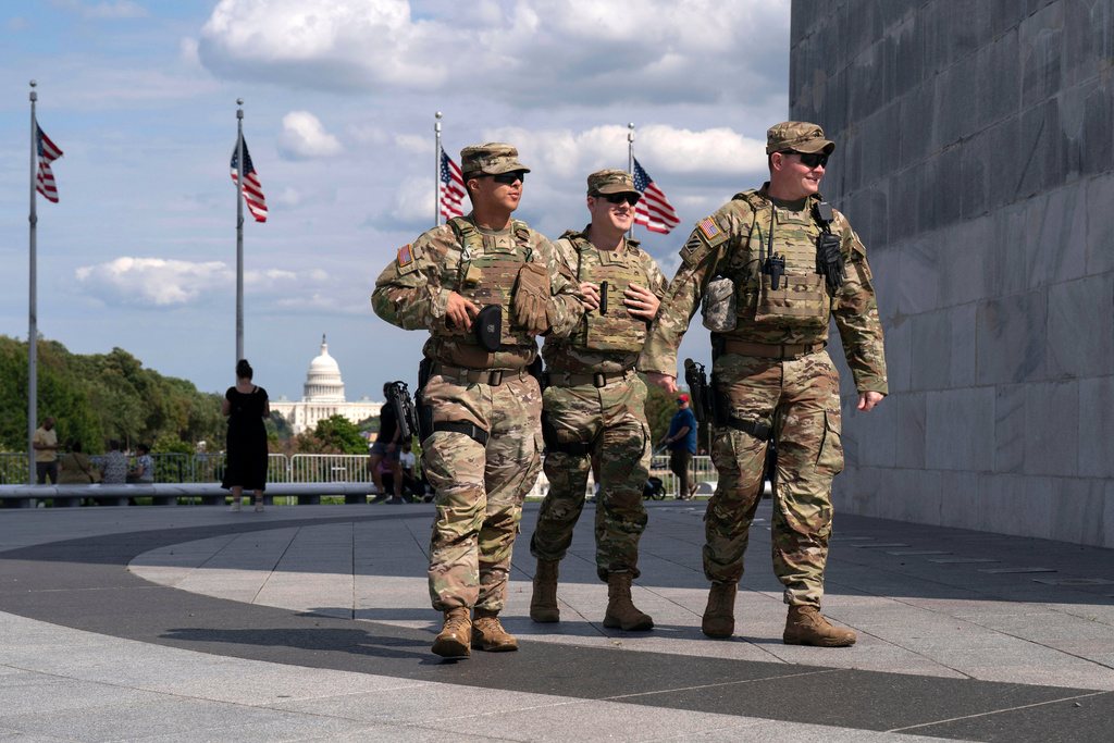 FILE - Members of the Louisiana National Guard patrol the grounds of the Washington Monument at the National Mall, Sept. 7, 2025, in Washington. (AP Photo/Jose Luis Magana, File)