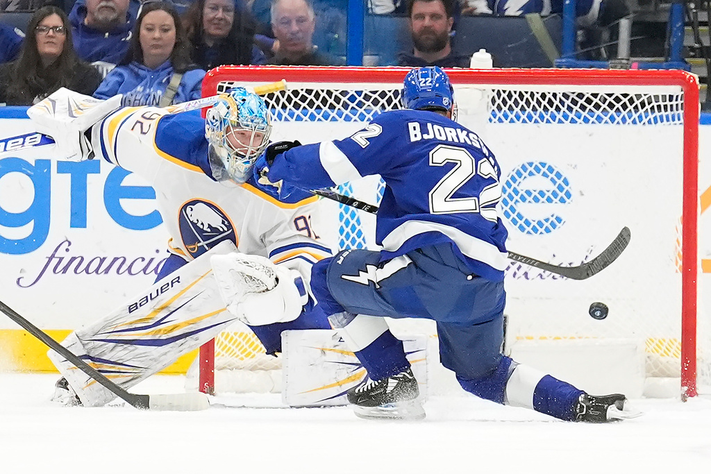 Tampa Bay Lightning right wing Oliver Bjorkstrand (22) scores past Buffalo Sabres goaltender Colten Ellis (92) during the third period of an NHL hockey game Tuesday, Feb. 3, 2026, in Tampa, Fla. (AP Photo/Chris O'Meara)