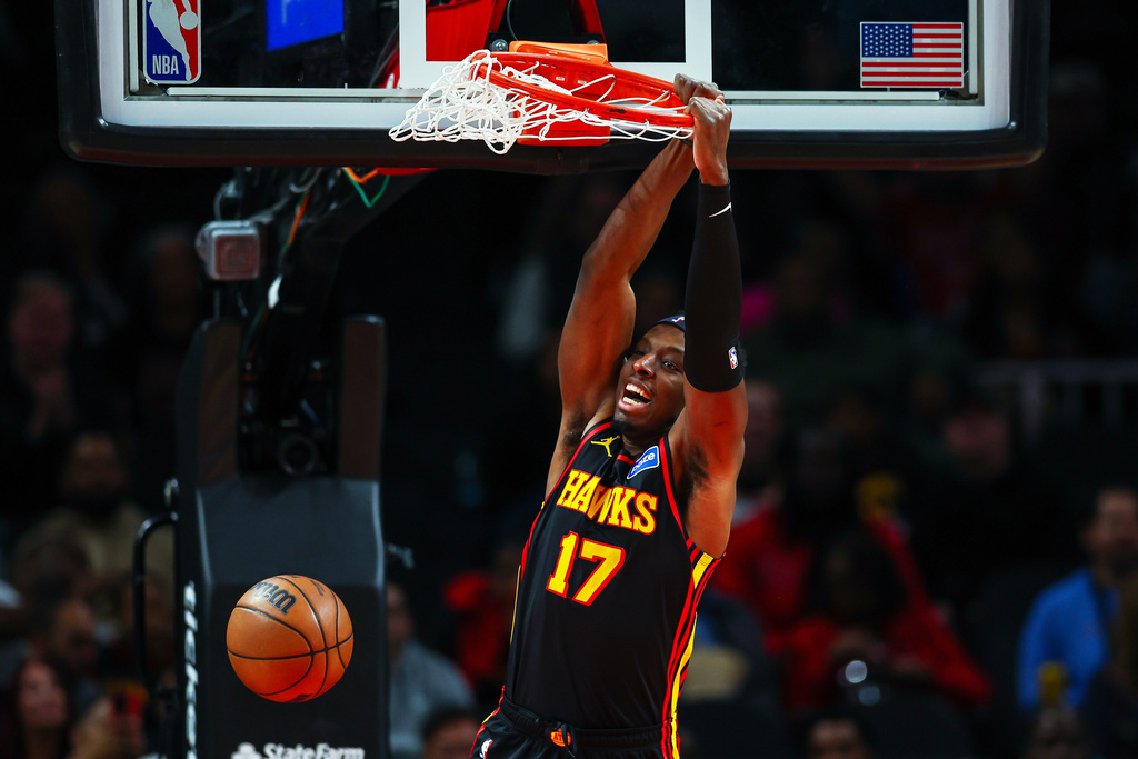 Atlanta Hawks forward Onyeka Okongwu (17) dunks during the first half of an NBA basketball game against the Chicago Bulls, Sunday, Dec. 21, 2025, in Atlanta. (AP Photo/Colin Hubbard)