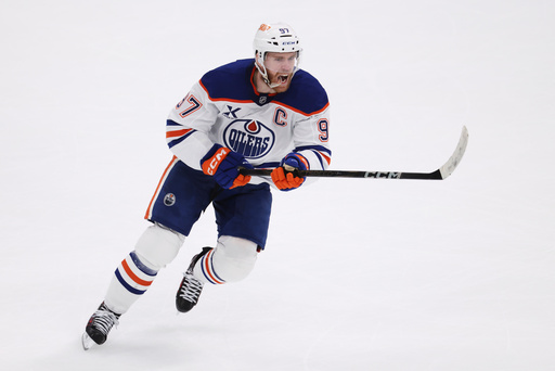 FILE - Edmonton Oilers center Connor McDavid celebrates after scoring against the Dallas Stars during the second period of Game 5 of the Western Conference finals in the NHL hockey Stanley Cup playoffs, May 29, 2025, in Dallas. (AP Photo/Gareth Patterson, file) FILE - Edmonton Oilers center Connor McDavid celebrates after scoring against the Dallas Stars during the second period of Game 5 of the Western Conference finals in the NHL hockey Stanley Cup playoffs, May 29, 2025, in Dallas. (AP Photo/Gareth Patterson, file)