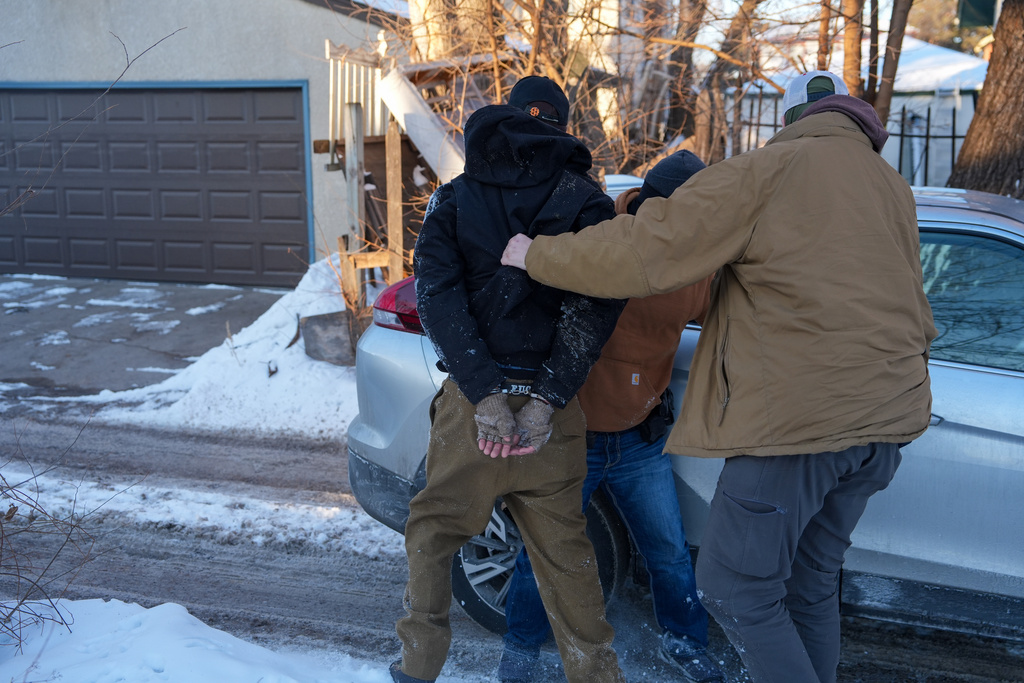 An activist is detained by federal agents on Tuesday, Feb. 3, 2026, in Minneapolis. (AP Photo/Ryan Murphy)