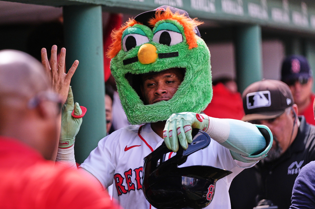 Boston Red Sox's Ceddanne Rafaela is congratulated after his solo home run in the fourth inning during the first baseball game of a doubleheader against the Baltimore Orioles, Wednesday, July 22, 2026, in Boston. (AP Photo/Charles Krupa)