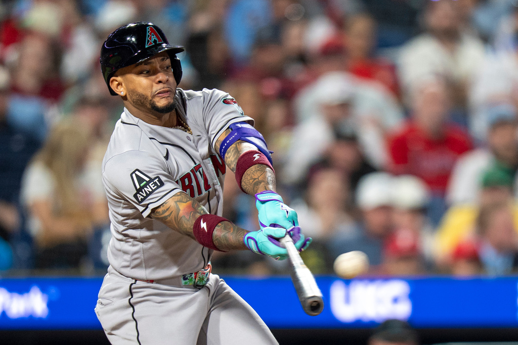 Arizona Diamondbacks' Ketel Marte hits a two-run single during the fifth inning of a baseball game against the Philadelphia Phillies, Friday, April 10, 2026, in Philadelphia. (AP Photo/Chris Szagola)