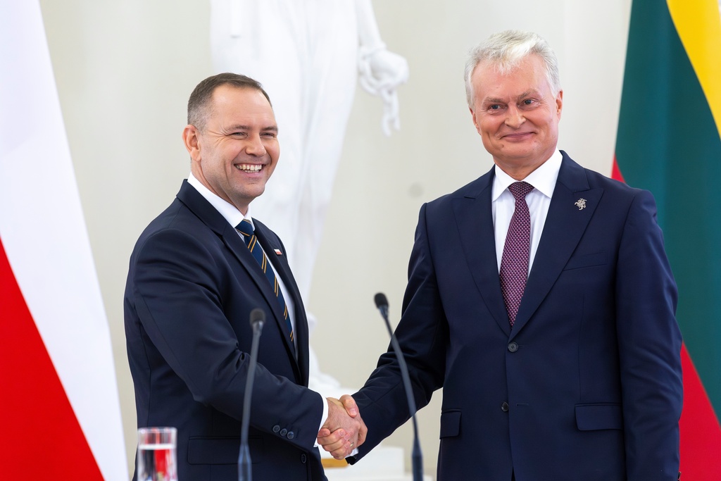 FILE - Polish President Karol Nawrocki, left, shakes hands with Lithuania's President Gitanas Nauseda after a joint press conference at the President's palace in Vilnius, Lithuania, Monday, Sept. 8, 2025. (AP Photo/Mindaugas Kulbis, file)