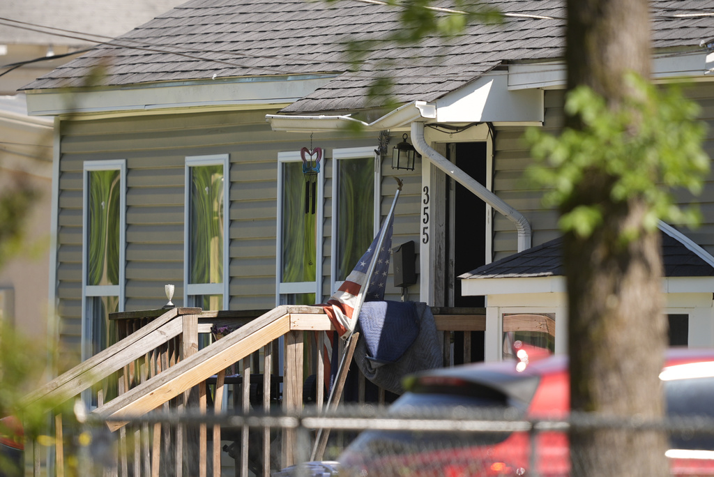 Police block off a house in Shreveport, La., that is one of the locations tied to a mass shooting Sunday, April 19, 2026. (AP Photo/Gerald Herbert)