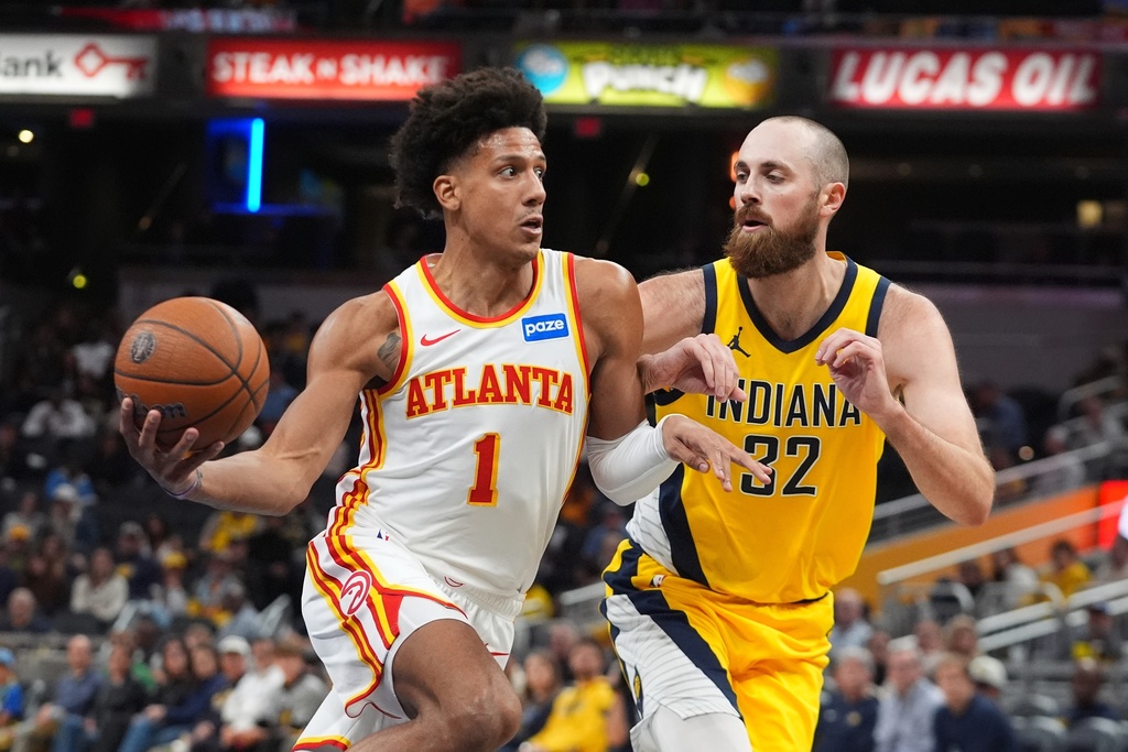 Atlanta Hawks' Jalen Johnson (1) goes to the basket against Indiana Pacers' Jay Huff (32) during the second half of an NBA Cup basketball game, Friday, Oct. 31, 2025, in Indianapolis. (AP Photo/Darron Cummings)