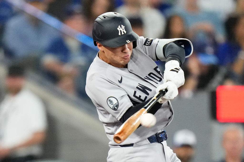 New York Yankees' Anthony Volpe hits an RBI single off Toronto Blue Jays pitcher Patrick Corbin during the second inning of a baseball game in Toronto on Sunday June 14, 2026. (Chris Young/The Canadian Press via AP)