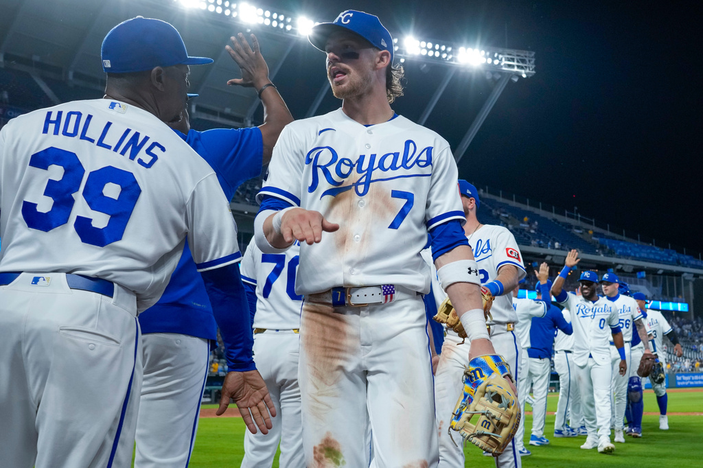 Kansas City Royals shortstop Bobby Witt Jr. (7) celebrates with teammates after their baseball game against the Cleveland Guardians, Monday, May 4, 2026, in Kansas City, Mo. (AP Photo/Charlie Riedel)