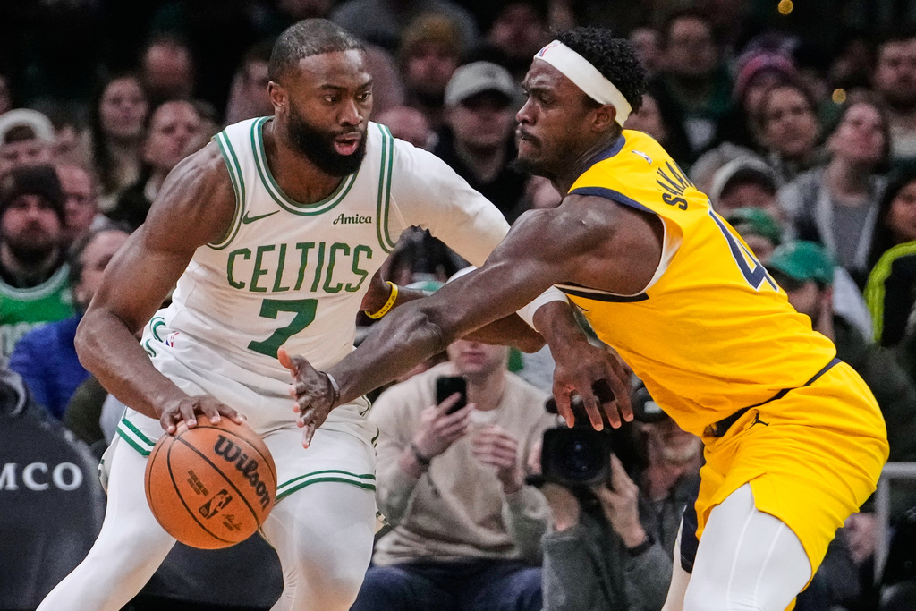 Boston Celtics guard Jaylen Brown (7) drives to the basket against Indiana Pacers forward Pascal Siakam (43) during the first half of an NBA basketball game, Wednesday, Jan. 21, 2026, in Boston. (AP Photo/Charles Krupa)