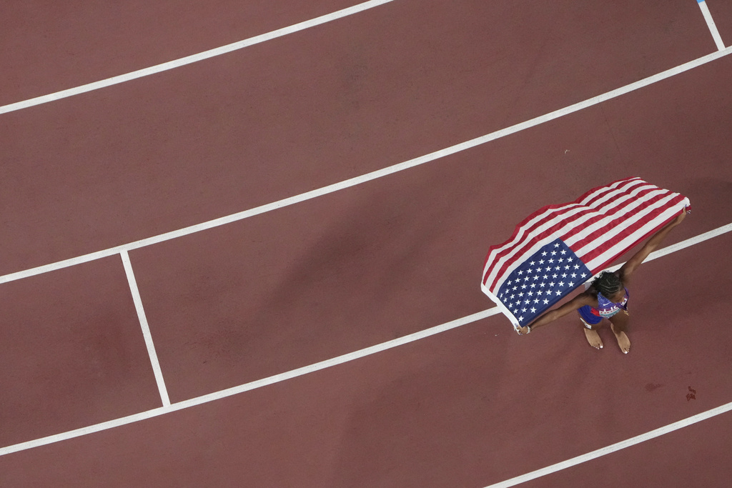 United States' Melissa Jefferson-Wooden celebrates after winning the women's 200 meters final at the World Athletics Championships in Tokyo, Friday, Sept. 19, 2025. (AP Photo/David J. Phillip)