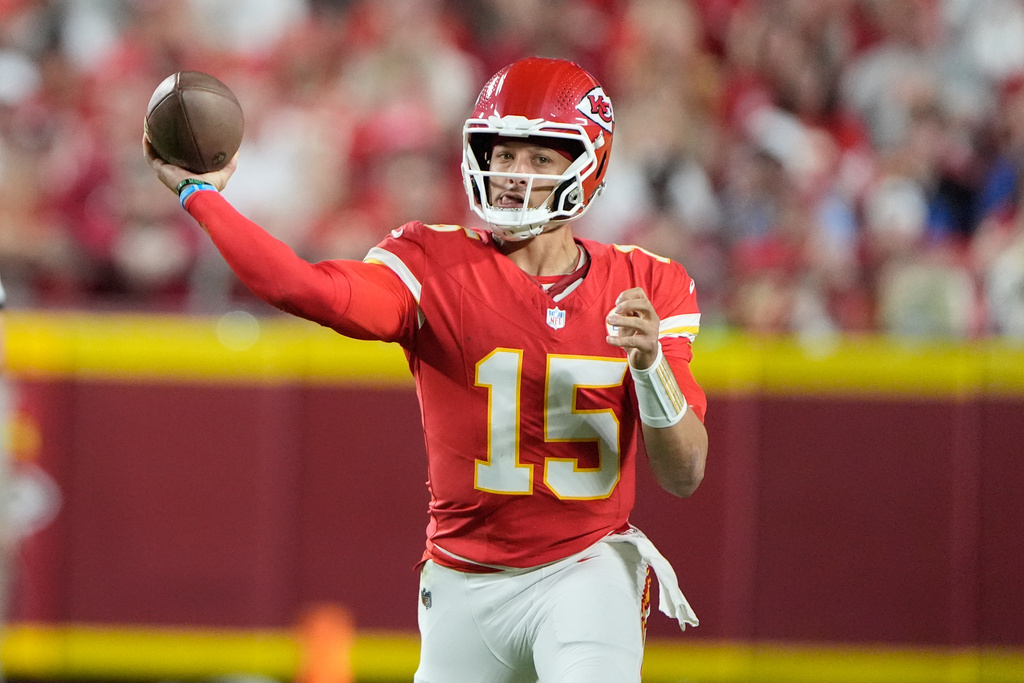 Kansas City Chiefs quarterback Patrick Mahomes throws during the first half of an NFL football game against the Detroit Lions Sunday, Oct. 12, 2025, in Kansas City, Mo. (AP Photo/Charlie Riedel)