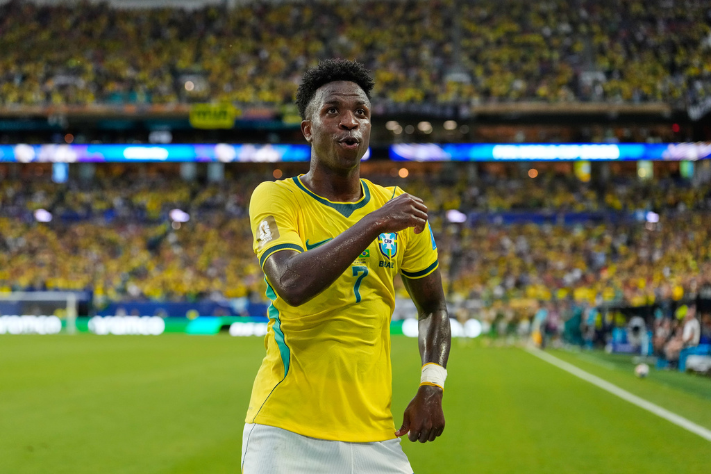 Brazil's Vinicius Junior (7) celebrates after scoring his side's second goal during the World Cup Group C soccer match between Scotland and Brazil in Miami Gardens, Fla., Wednesday, June 24, 2026. (AP Photo/Rebecca Blackwell)