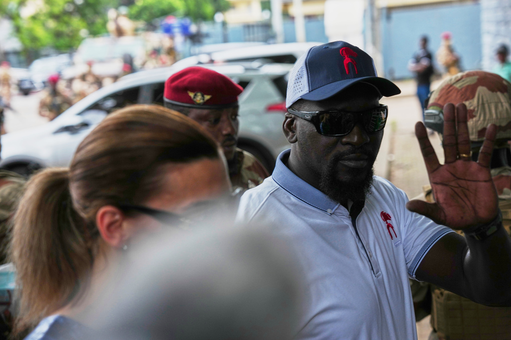Guinea's interim President, Gen. Mamadi Doumbouya, arrives to cast his vote in the constitutional referendum in Conakry, Guinea, Sunday, Sept. 21, 2025. (AP Photo/Misper Apawu)